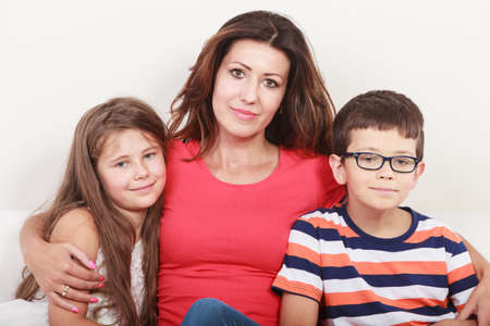 files/47784225-happy-family-mother-woman-and-kids-little-girl-and-boy-sitting-at-sofa-couch-at-home.jpg